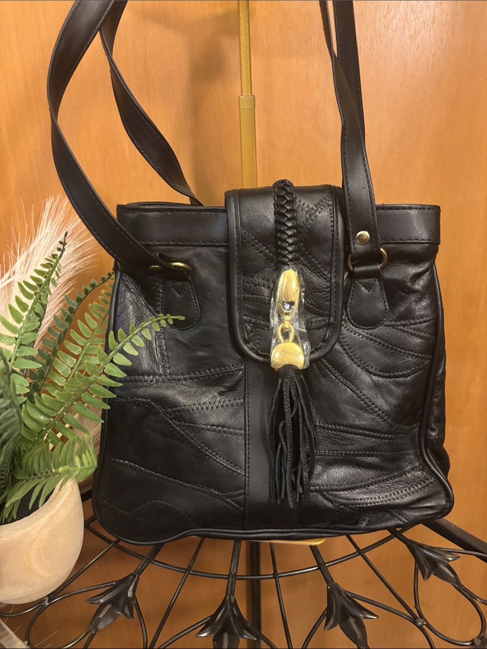 Women's Black Leather Shoulder Bag with Tassel and Gold Accent